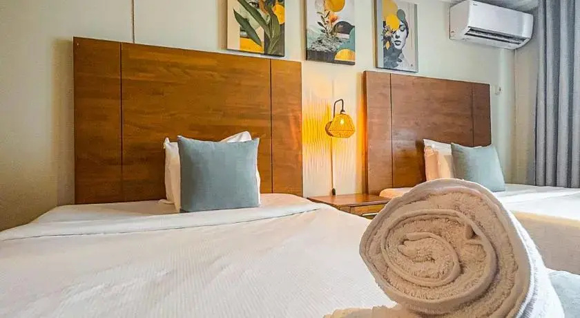Majestic City Suites & Beach Hotel - Chambres