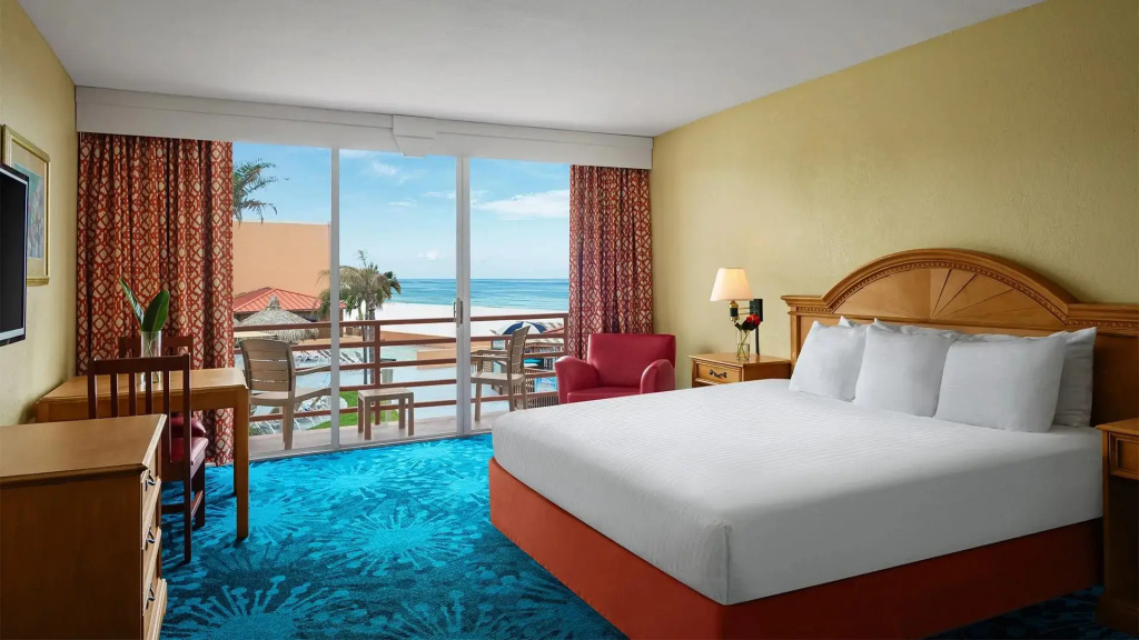 Room with balcony and with pool view