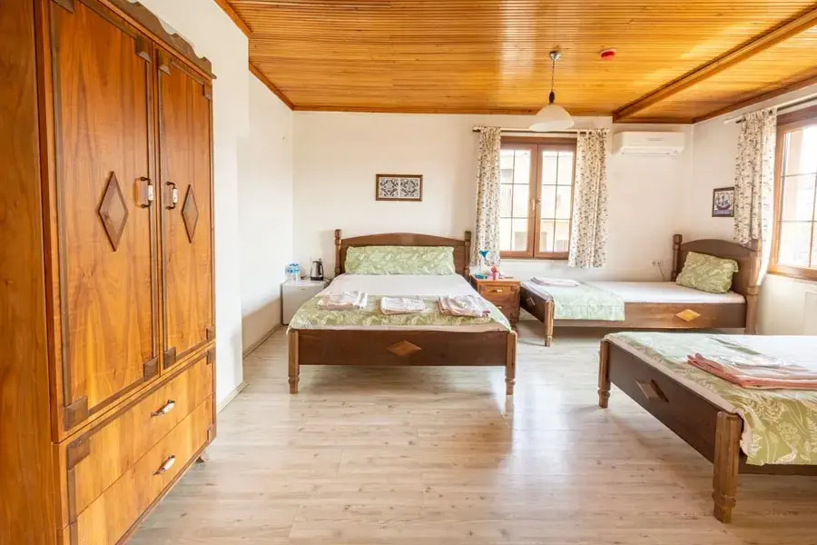 Family Quadruple room with balcony and with garden view