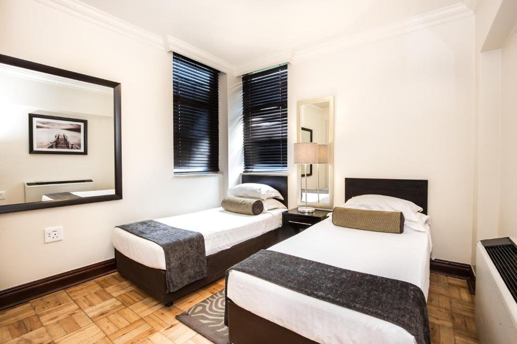 Belaire Suites - Chambres