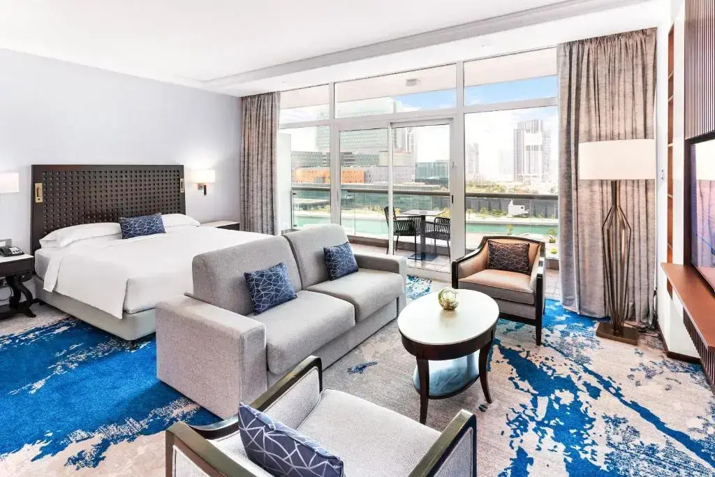 Family with sofa bed room with sea view