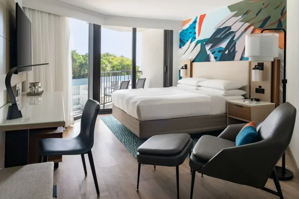 Room with balcony and with pool view