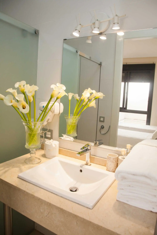 Guzman El Bueno Suites - Chambres