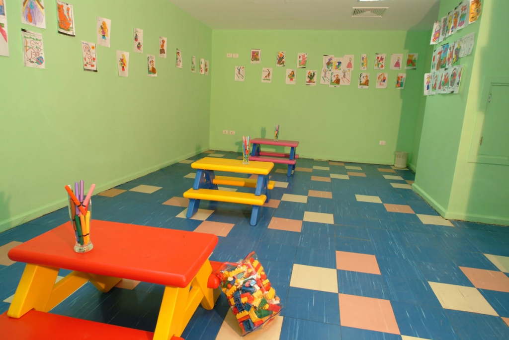 Sun Resort Aqua Park Sharm El-Sheikh: A bright children's activity room with art supplies, colorful tables, and building blocks.