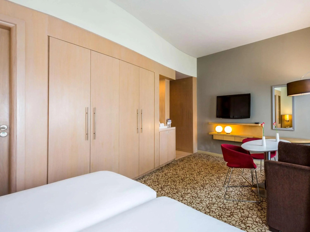 Отель Novotel Suites Mall Avenue Dubai