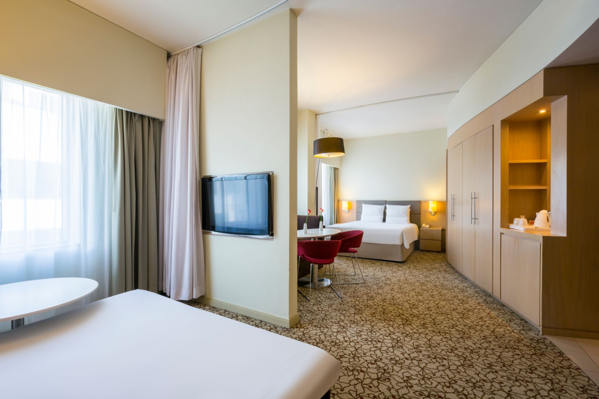 Отель Novotel Suites Mall Avenue Dubai