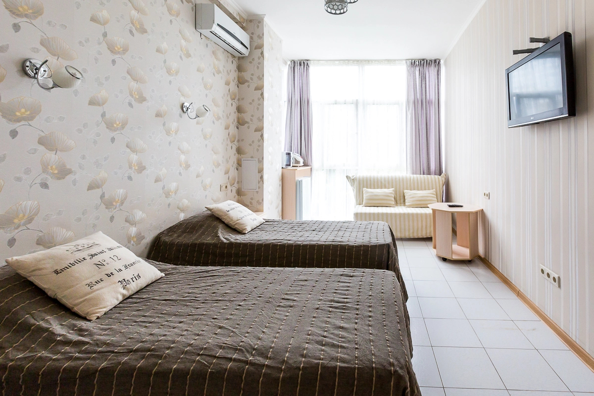 Апартаменты Светлана-Центр у моря с видом на сад магнолий