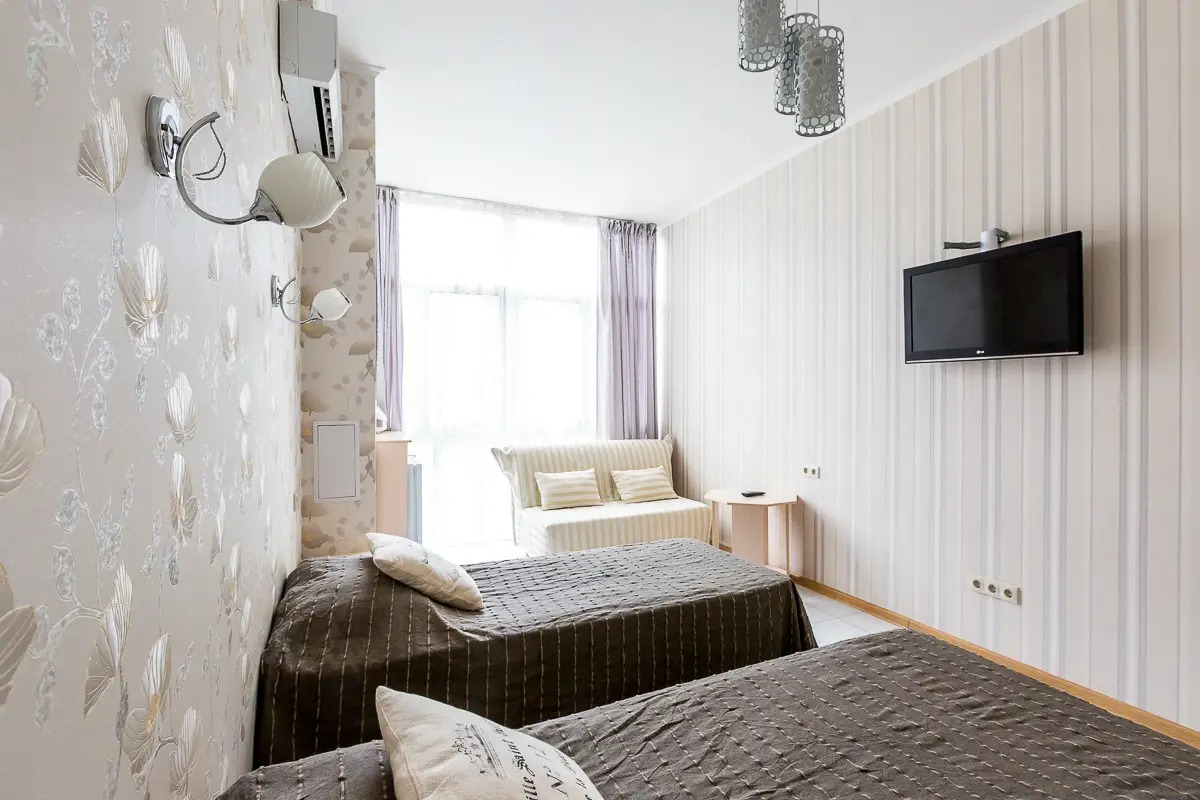 Апартаменты Светлана-Центр у моря с видом на сад магнолий