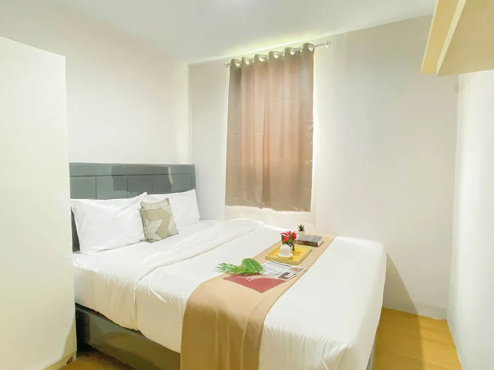 Simple 2Br At Azalea Suites Apartment
