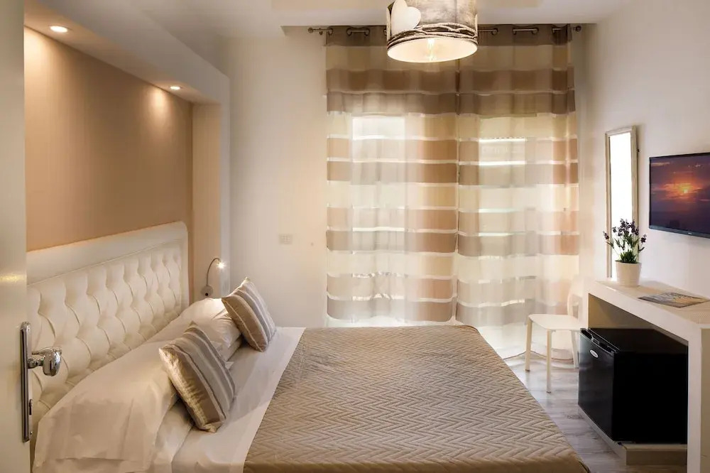 Photo - Sorrento Comfort Rooms con piscina