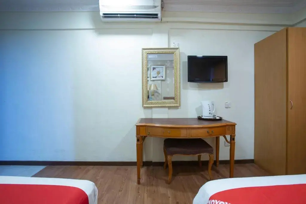 Photo - Capital O Hotel Grand Orchard