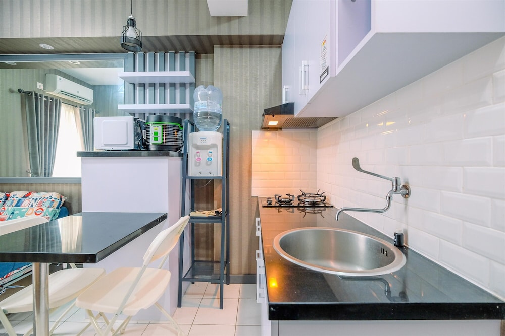 Homey and Cozy Living 2BR Podomoro Golf View Apartment