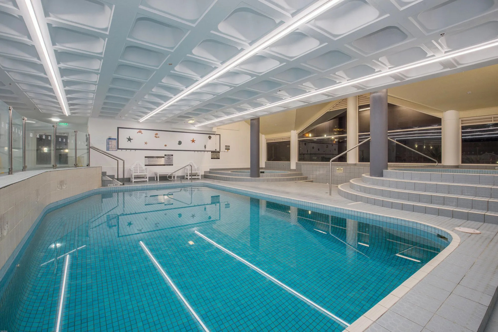 Photo - Surfers Aquarius on the Beach