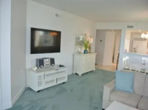 Deluxe Beachfront Condo Located in Prestigious Resort with Pool and Hot Tub by RedAwning