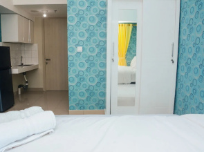 Cozy with City View @ Studio Springlake Bekasi Apartment By Travelio
