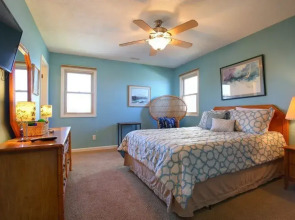 Windchimes 4 Bedroom Home by RedAwning