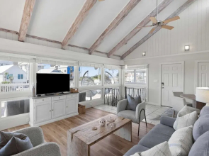 Beach Retreat w/ Sundeck, Golf Cart & Bikes Bungalow House by Avantstay