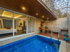 SaffronStays Urja, Lonavala - 3 BR Villa with 2 pools, spa room, jacuzzi, private elevator & waterfall