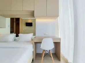 Cozy Stay Studio Apartment at Tree Park City BSD By Travelio
