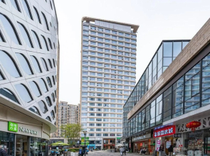 Caomu Nianhua Apartment (Binjiang Branch)(草木年华公寓（滨江宝龙城店）)
