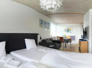 2 rooms, private kitchen, bathroom, and garden.