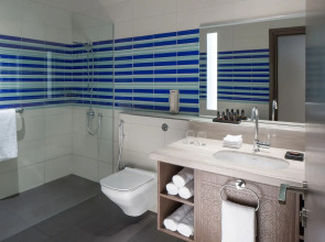 Отель Naumi Dubai