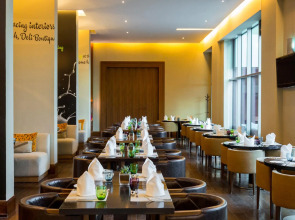 Отель Novotel Suites Mall Avenue Dubai