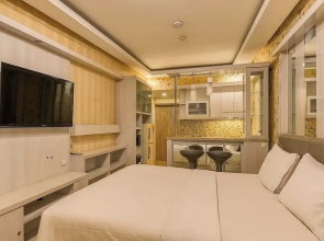 Quintessa Room at Candiland Apartement