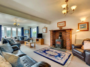 Detached Holiday Home With a Colourful Garden, Stove and Cosy Furnishings