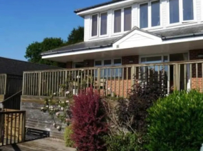 Fantastic spacious house with beautiful panoramic views of the bay Only a few minutes walk from beach harbour and restaurants This house has 3 bedrooms 3 bathrooms and 2 lovely sitting rooms