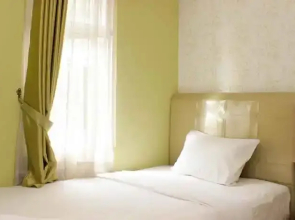 Homey and Warm 2BR at Springlake Summarecon Bekasi Apartment By Travelio