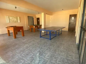 Village (Kitnet) com piscina, à 400mts da Praia.