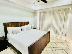 Spectacular 1 1/2 Bedroom Condo on Sandy Beach at Las Palmas Beachfront Resort 1 Condo by RedAwning