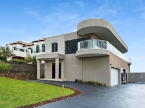 Cliffside Castle With Bay And City Views