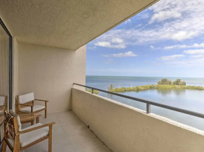 Waterfront Resort Condo w/ Private Beach & Pool