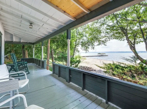 Torch Lake Getaway w/ Private Beach + Boat Dock!