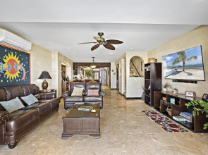 Luxury Beachfront Condo w/ High-End Wood Furnishings and Ocean Views in Exclusive Community