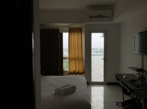 Homey and Nice Studio Apartment at Scientia Residence