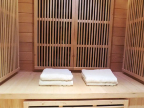 Detached villa with enclosed wooded garden with lawn, jacuzzi and infrared sauna