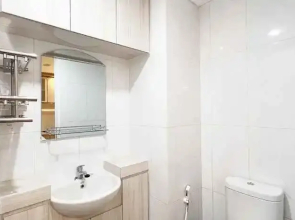 Homey and Good Deal 1BR Tamansari Skylounge Makassar Apartment By Travelio