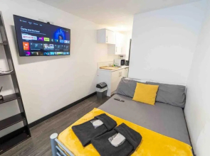 Cozy studios available for short term stays 10 mins from the city! Free WIFI &50" SMART TV's!