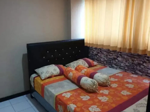 THE ROOMOS Hotel Apartemen