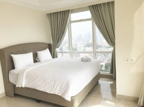 Luminous 2 Bedrooms at Menteng Park Apartment by Travelio
