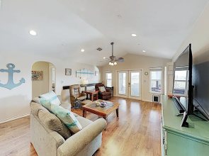 Canal-front Getaway W/ Enclosed Deck & Boat Dock 4 Bedroom Home