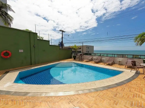 Confortável suíte com vista mar em Ponta Negra por Carpediem