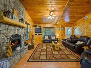 Cast Away Family Cabin with Hot Tub, Fireplace, and Kids Area by RedAwning