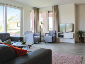 Beautiful villa with sauna, in a holiday park on the water in Friesland