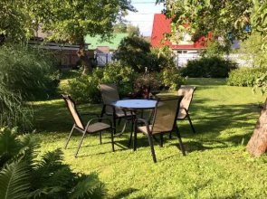 Solar Apartments - White House with garden