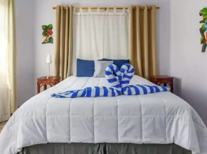 Elegant Condo with Brand-New Fixtures, Shaded Tropical Terrace, and Secluded Beach Access