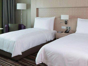 Отель Naumi Dubai